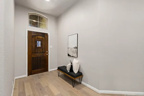 a bedroom with a bed and a mirror