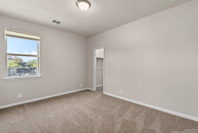 an empty room with windows