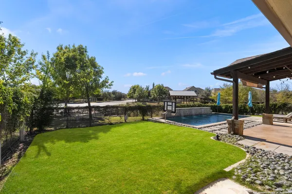 a view of a swimming pool with a patio