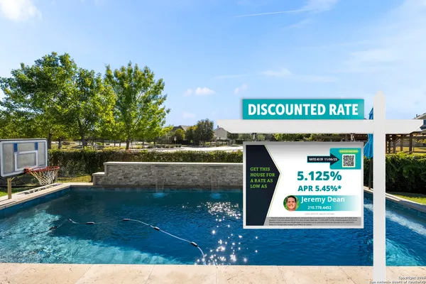 a view of a porch with furniture and floor to ceiling window
