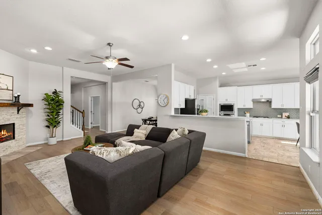 a living room with fireplace furniture and a fireplace