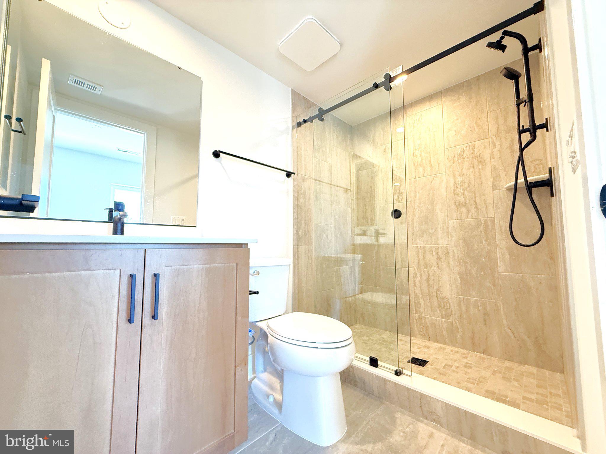 33 Lower Service Court Northwest Washington, DC 20001 - Photo 13 of 51 Sleek modern bathroom with glass shower.