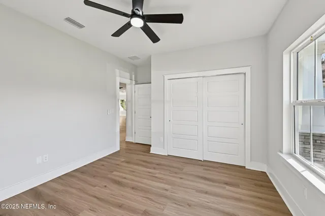 a bathroom with a toilet and shower