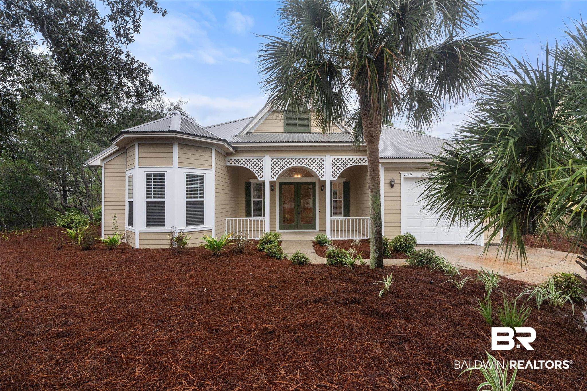 9259 Genipa Way Gulf Shores, AL 36542 - Photo 1 of 72 View of front facade featuring a garage and covered porch