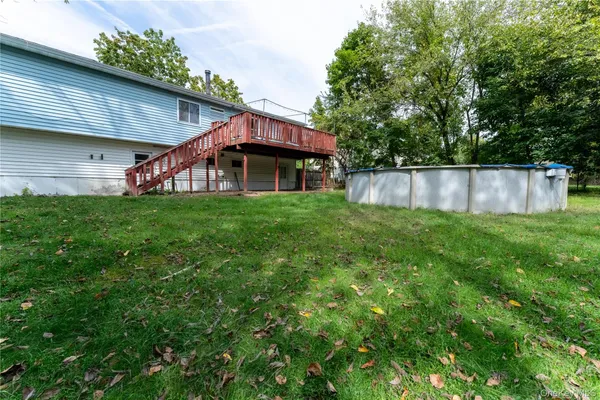 a view of a backyard of the house