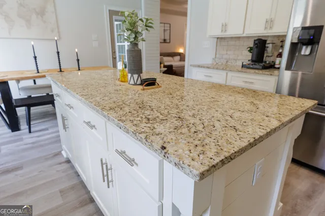 a view of a workspace with furniture and window