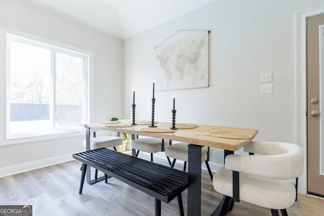 a spacious bedroom with a bed and a chandelier
