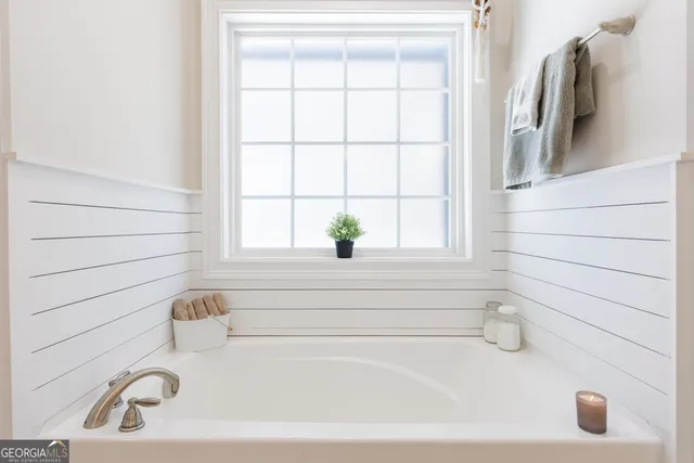 a bathroom with a glass shower door