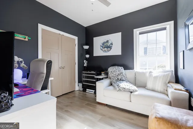 a bed room with a bed and a baby bed