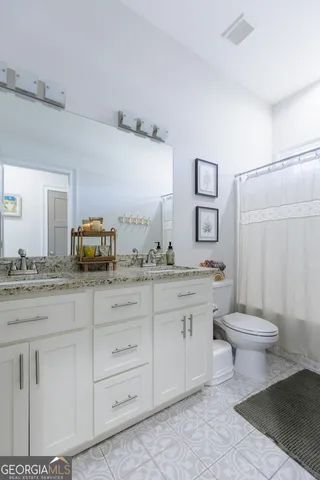 a utility room with sink dryer and washer