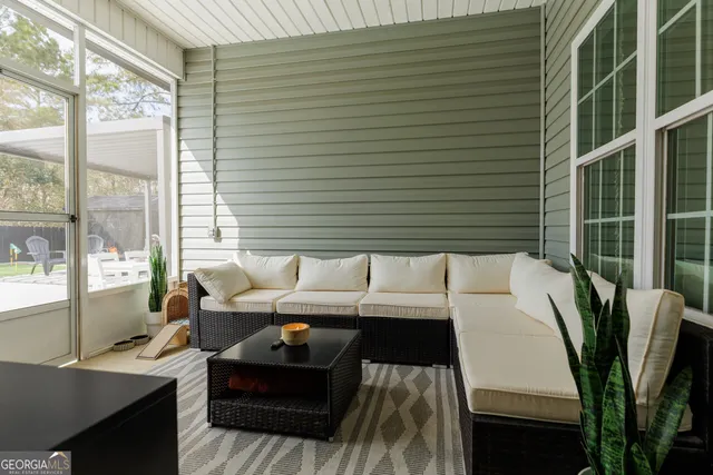 a view of a backyard with sitting area