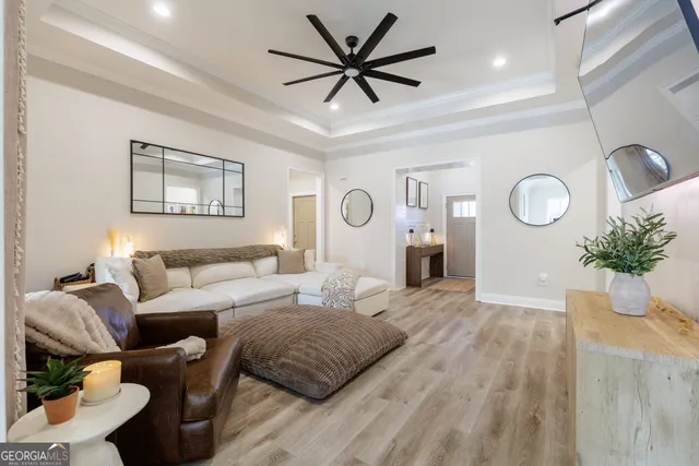 a kitchen with a dining table chairs and refrigerator
