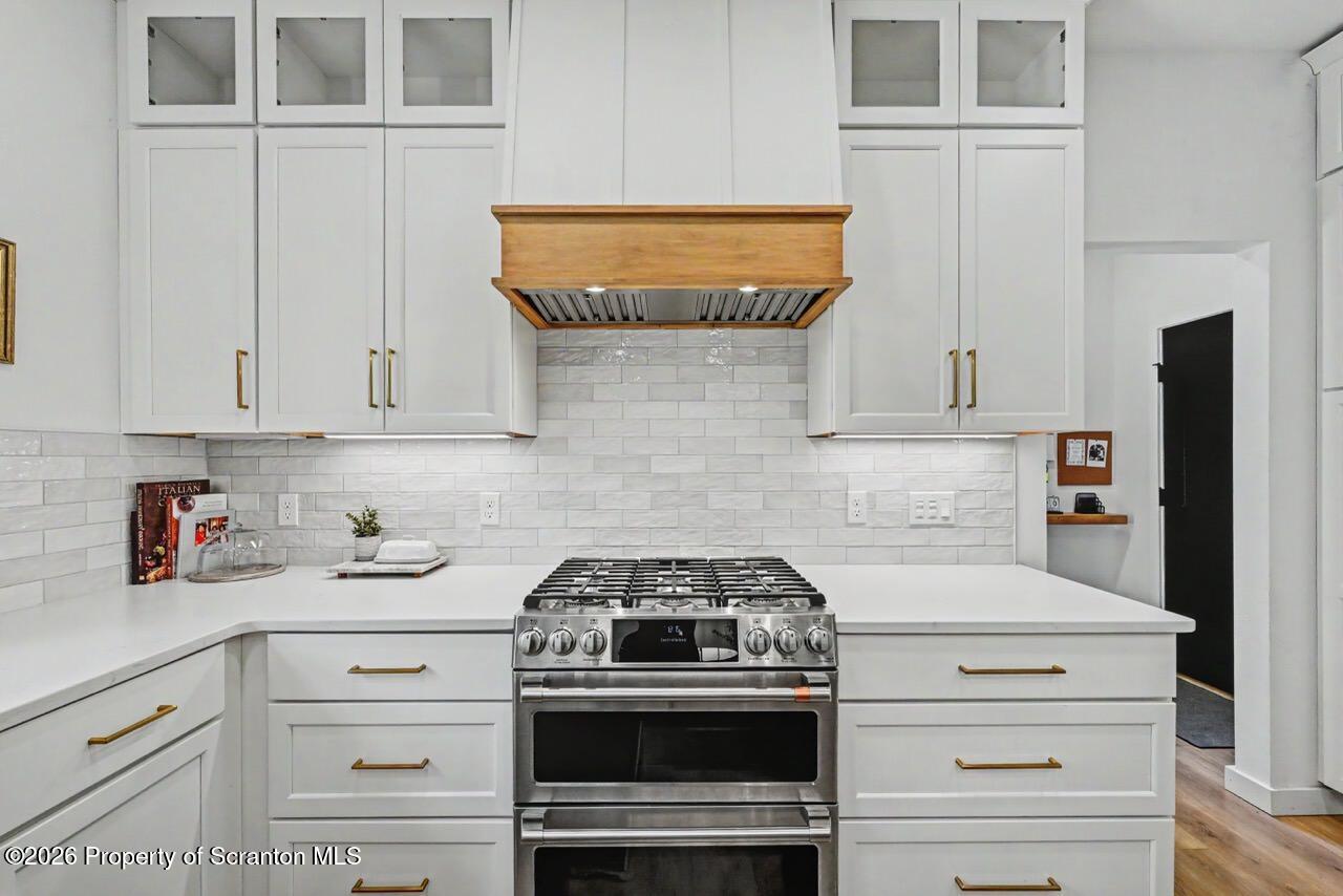 100 Highland Road Moscow, PA 18444 - Photo 24 of 85 a kitchen with stainless steel appliances granite countertop white cabinets and a stove