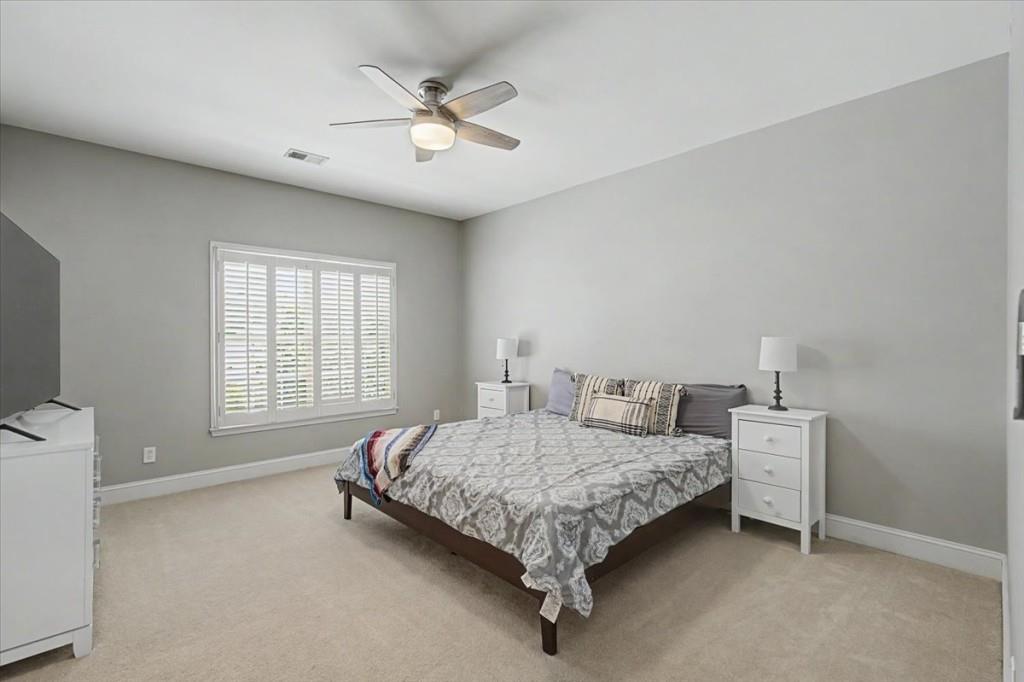 122 Ridge View Drive Ball Ground, GA 30107 - Photo 45 of 84 a bedroom with a bed and a window