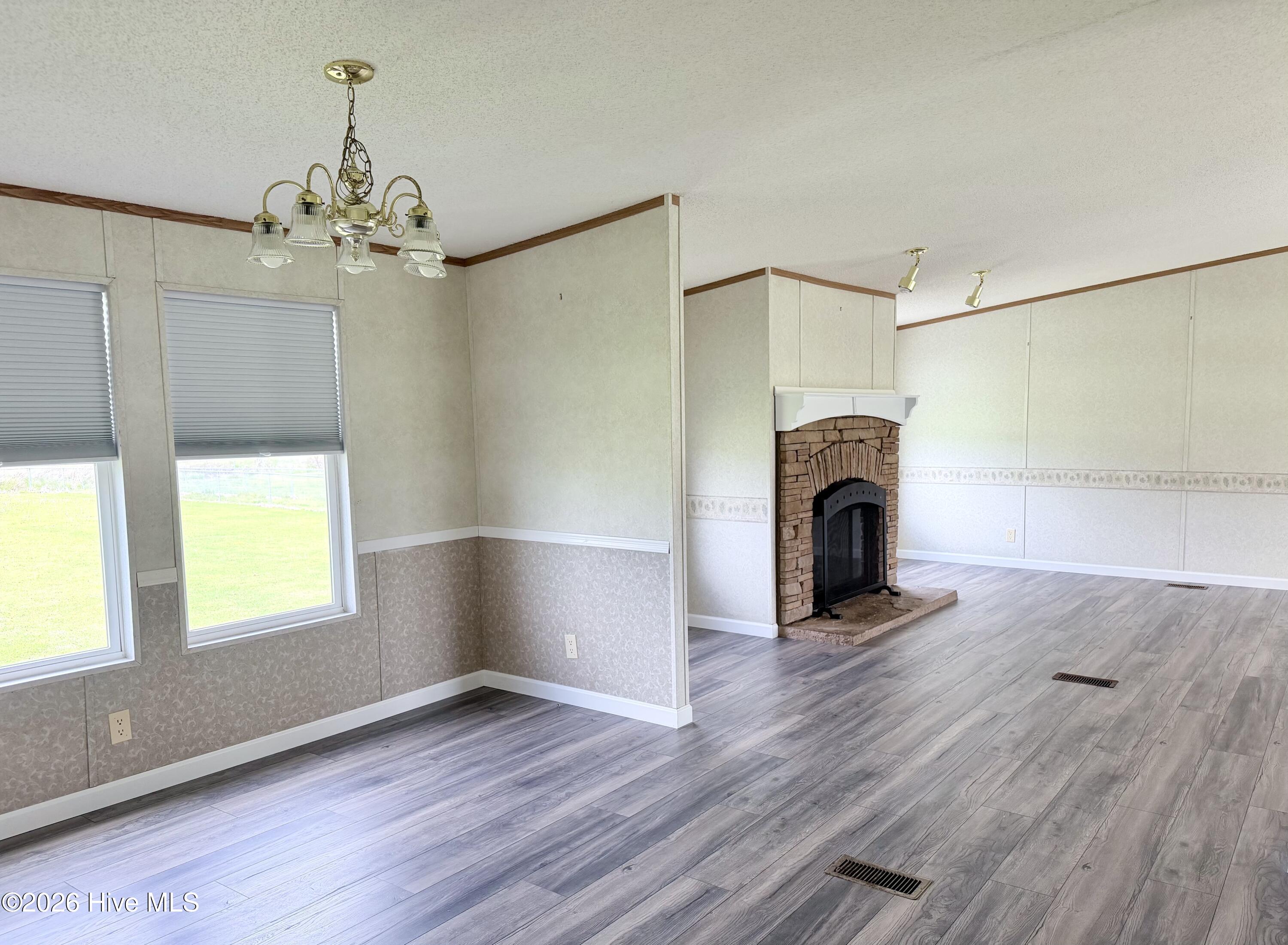 193 Mill Road Hertford, NC 27944 - Photo 9 of 34 Hallway walk-through to living room