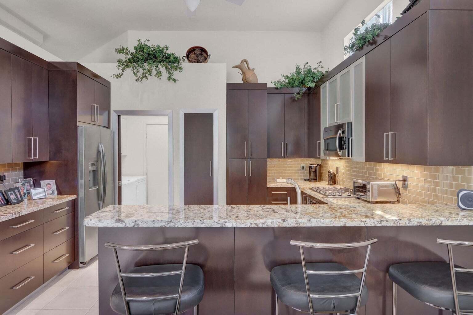 6255 Northwest 42nd Way Boca Raton, FL 33496 - Photo 7 of 16 Kitchen with Breakfast Bar