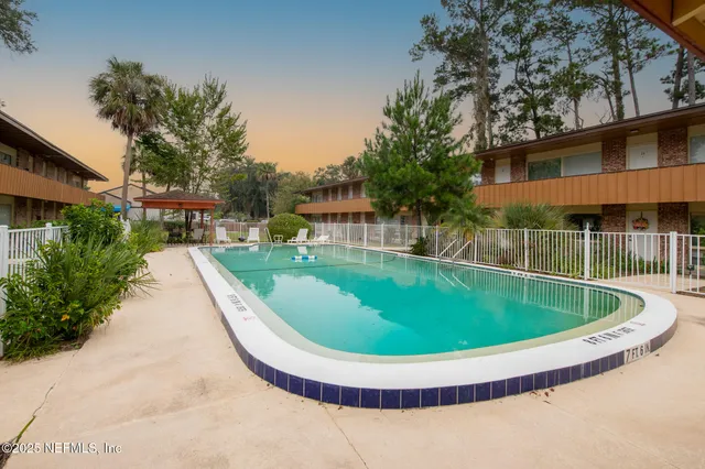 a view of a swimming pool with a garden
