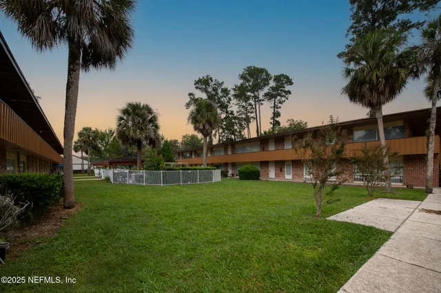 a view of backyard with a garden and entertaining space