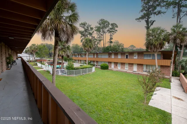 a view of swimming pool from a balcony