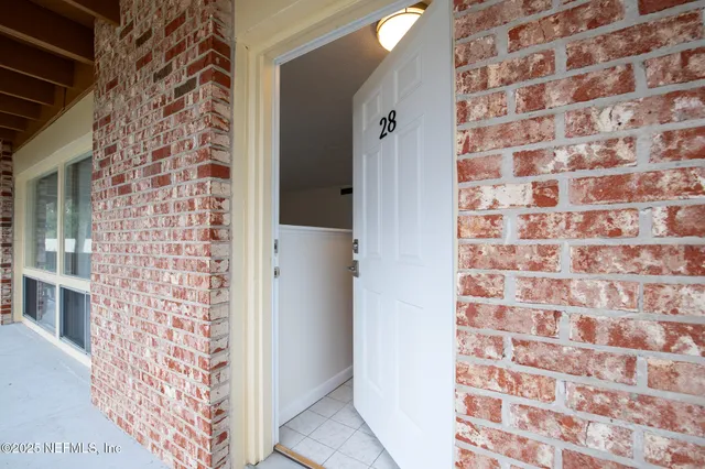 a view of kitchen with furniture and wooden floor