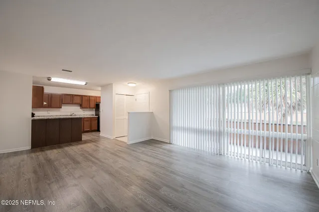 a kitchen with sink cabinets and stainless steel appliances
