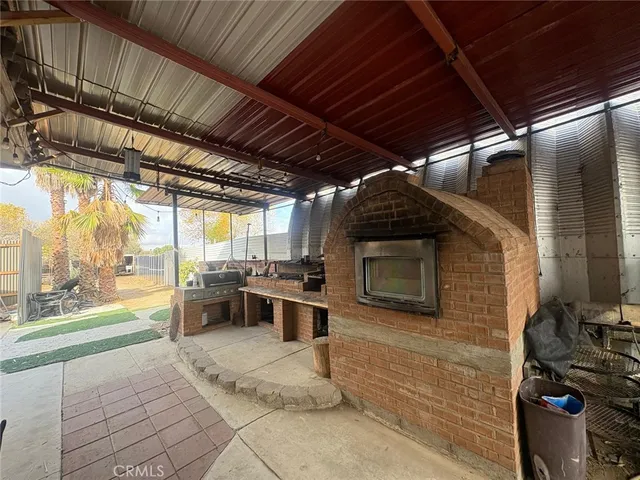 a view of a porch with furniture and a stove