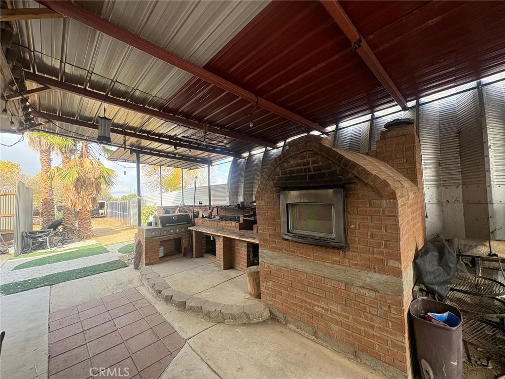 42150 Margoni Way Hemet, CA 92544 - Photo 4 of 10 a view of a porch with furniture and a stove