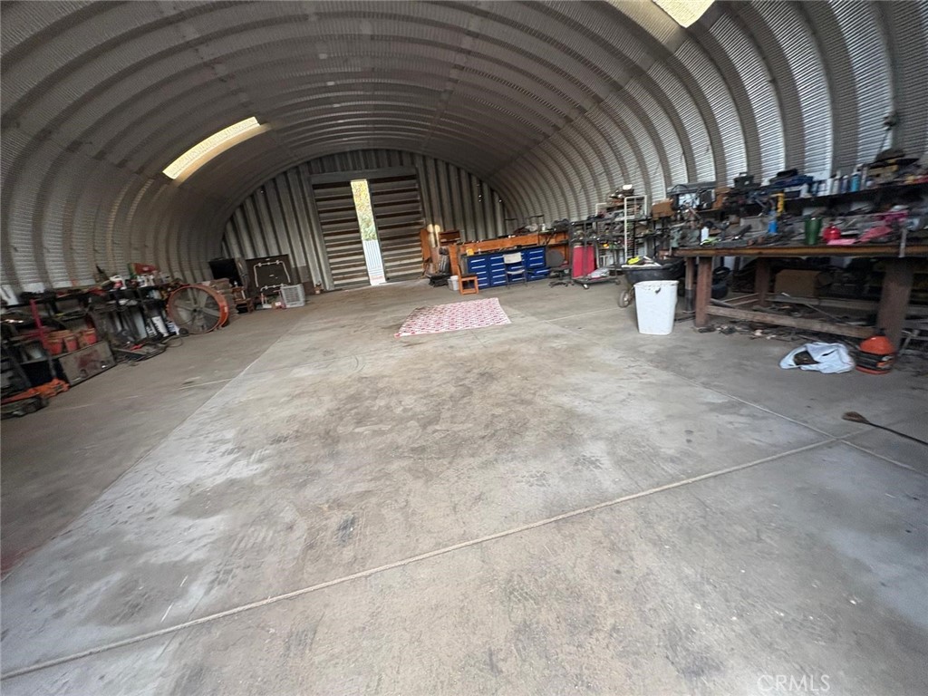 42150 Margoni Way Hemet, CA 92544 - Photo 5 of 10 a view of a garage with cars