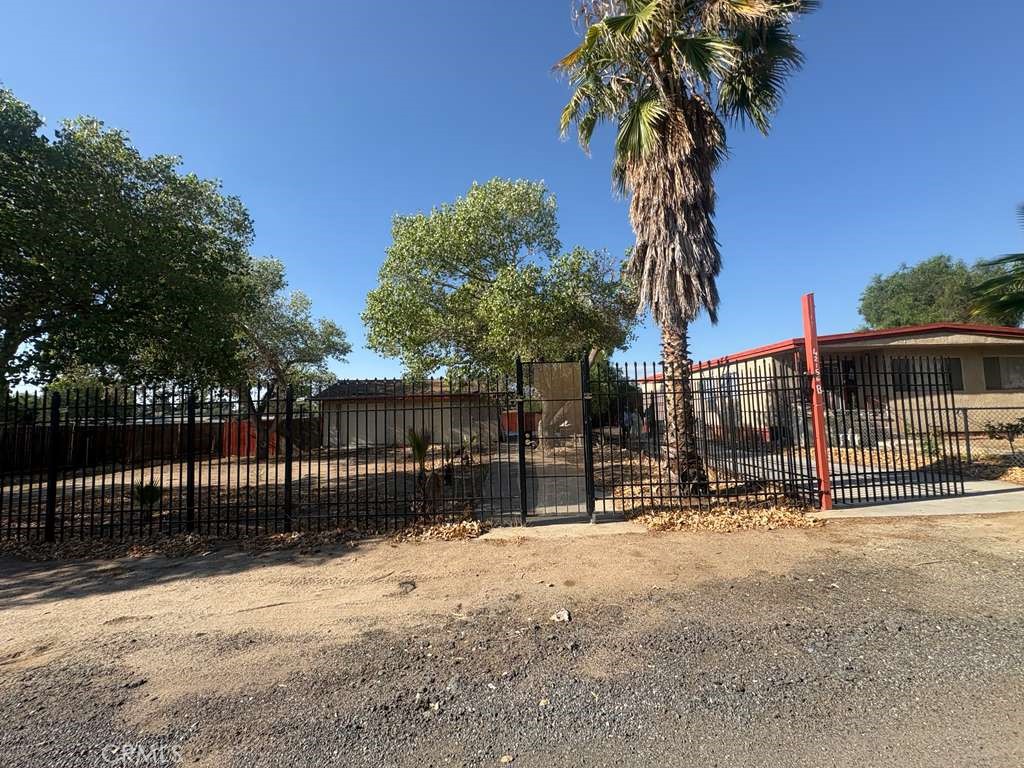 42150 Margoni Way Hemet, CA 92544 - Photo 7 of 10 a view of a backyard with large trees
