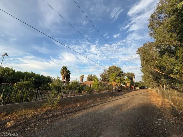 a view of a street with a building in the background