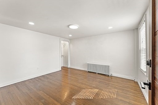 29-31 Pond Street Canton, MA 02021 - Photo 5 of 12 an empty room with wooden floor and windows