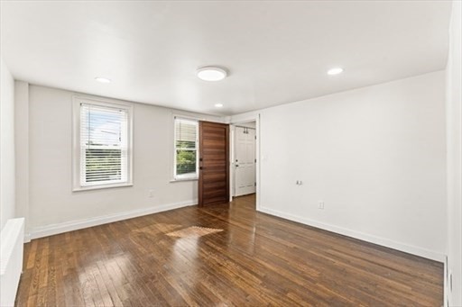 29-31 Pond Street Canton, MA 02021 - Photo 6 of 12 an empty room with wooden floor and windows