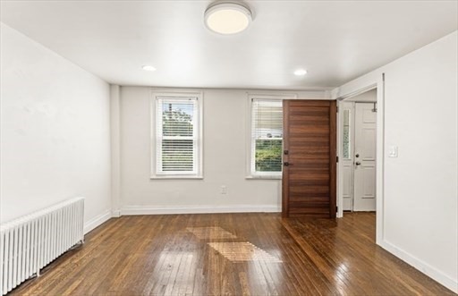 29-31 Pond Street Canton, MA 02021 - Photo 7 of 12 an empty room with wooden floor and windows