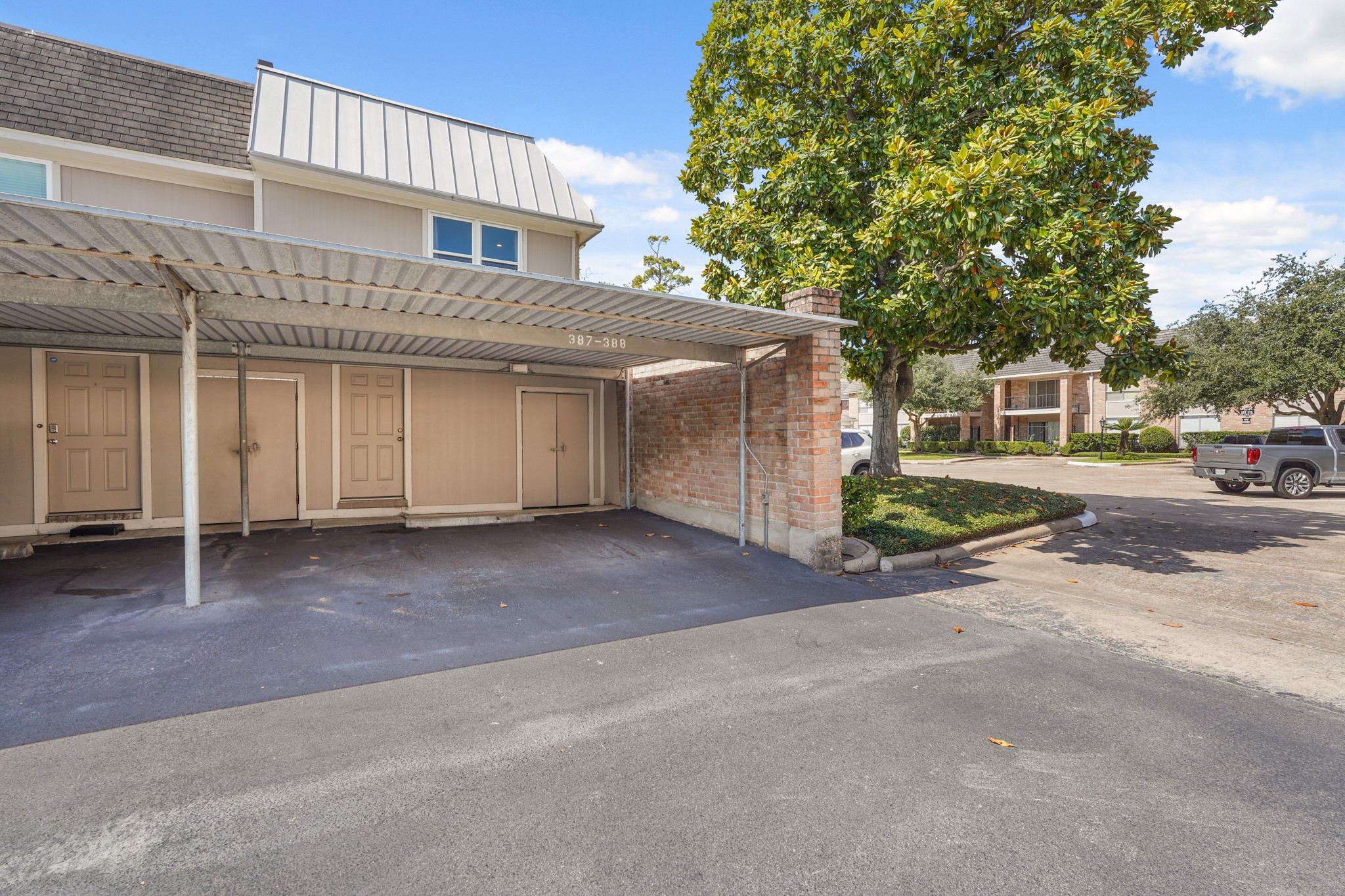 2236 South Piney Point Road, Unit 101 Houston, TX 77063 - Photo 19 of 21 Assigned parking space under this carport.