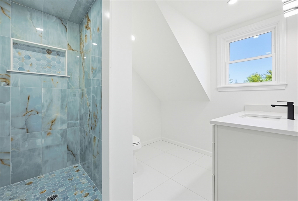 175 Pleasant Street Upton, MA 01568 - Photo 27 of 39 a bathroom with a sink and mirror