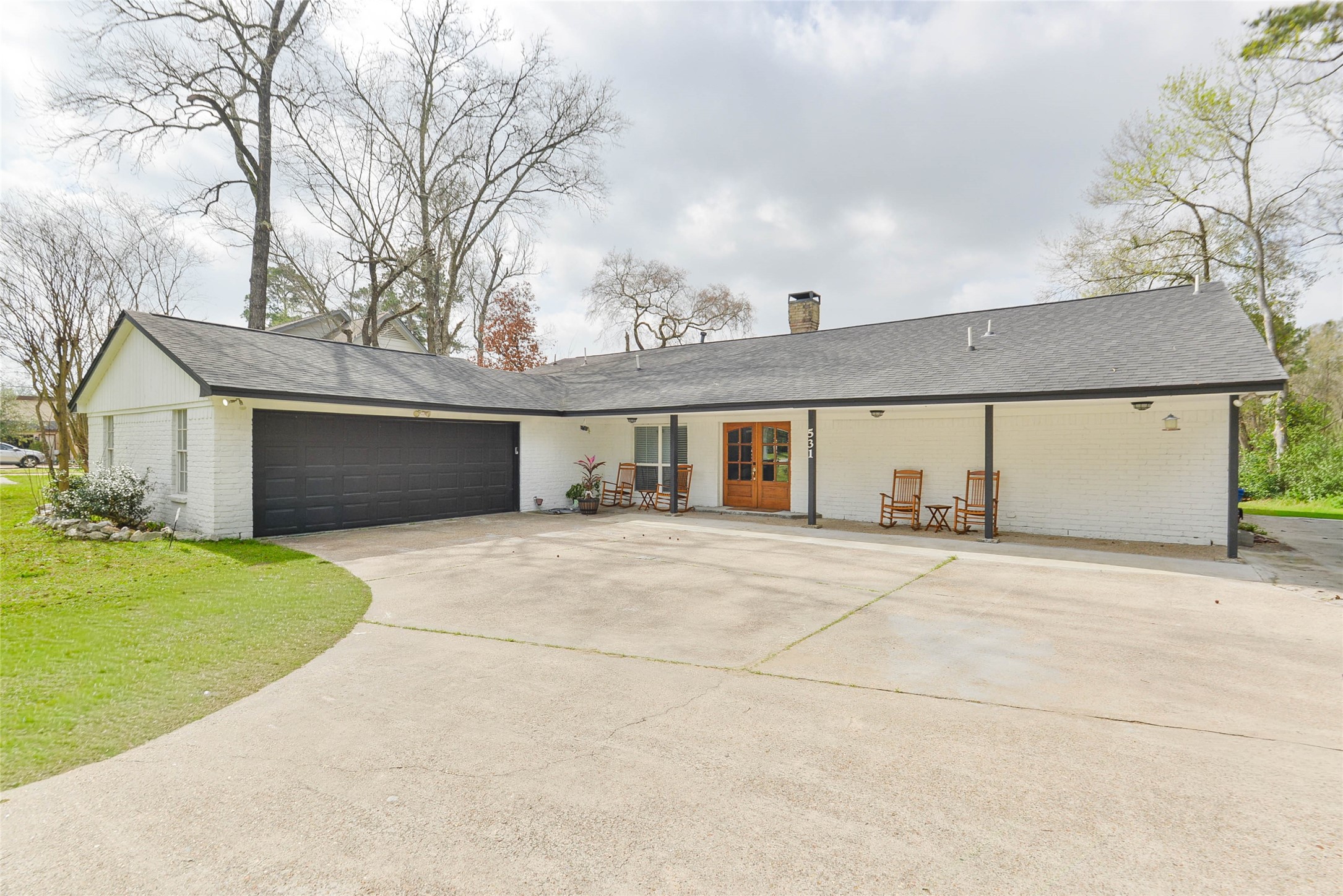 531 Brandon Road Conroe, TX 77302 - Photo 2 of 33 a front view of a house with a yard and garage