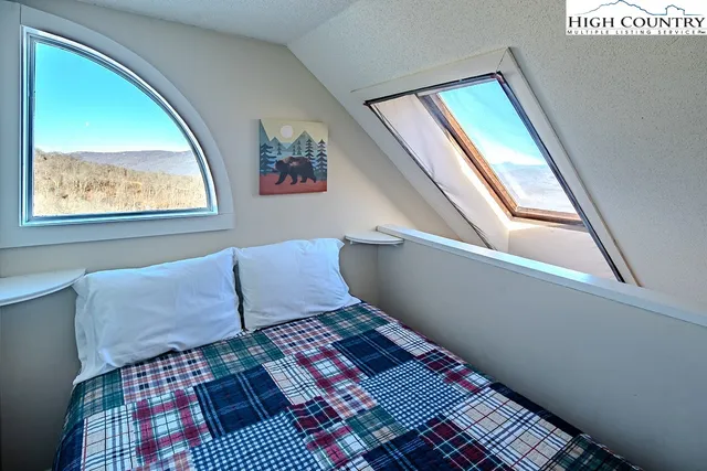 a living room with a couch and a rug