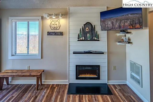 a view of a livingroom with furniture and a fireplace
