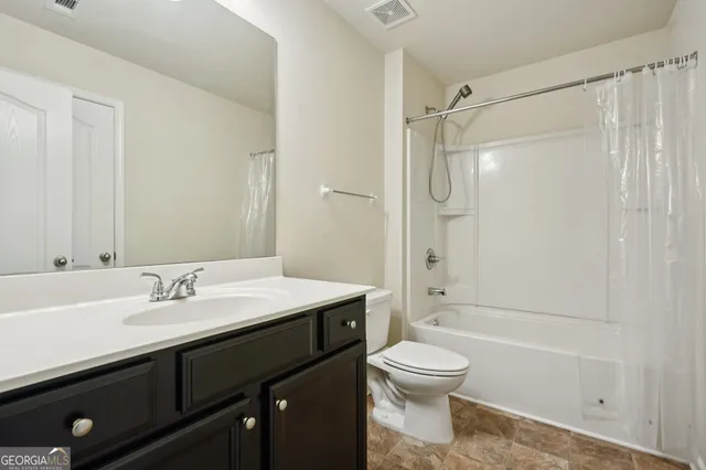 a bathroom with a sink a toilet and a bathtub