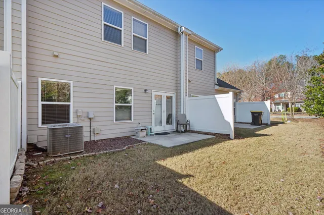 a view of a house with a yard and garage
