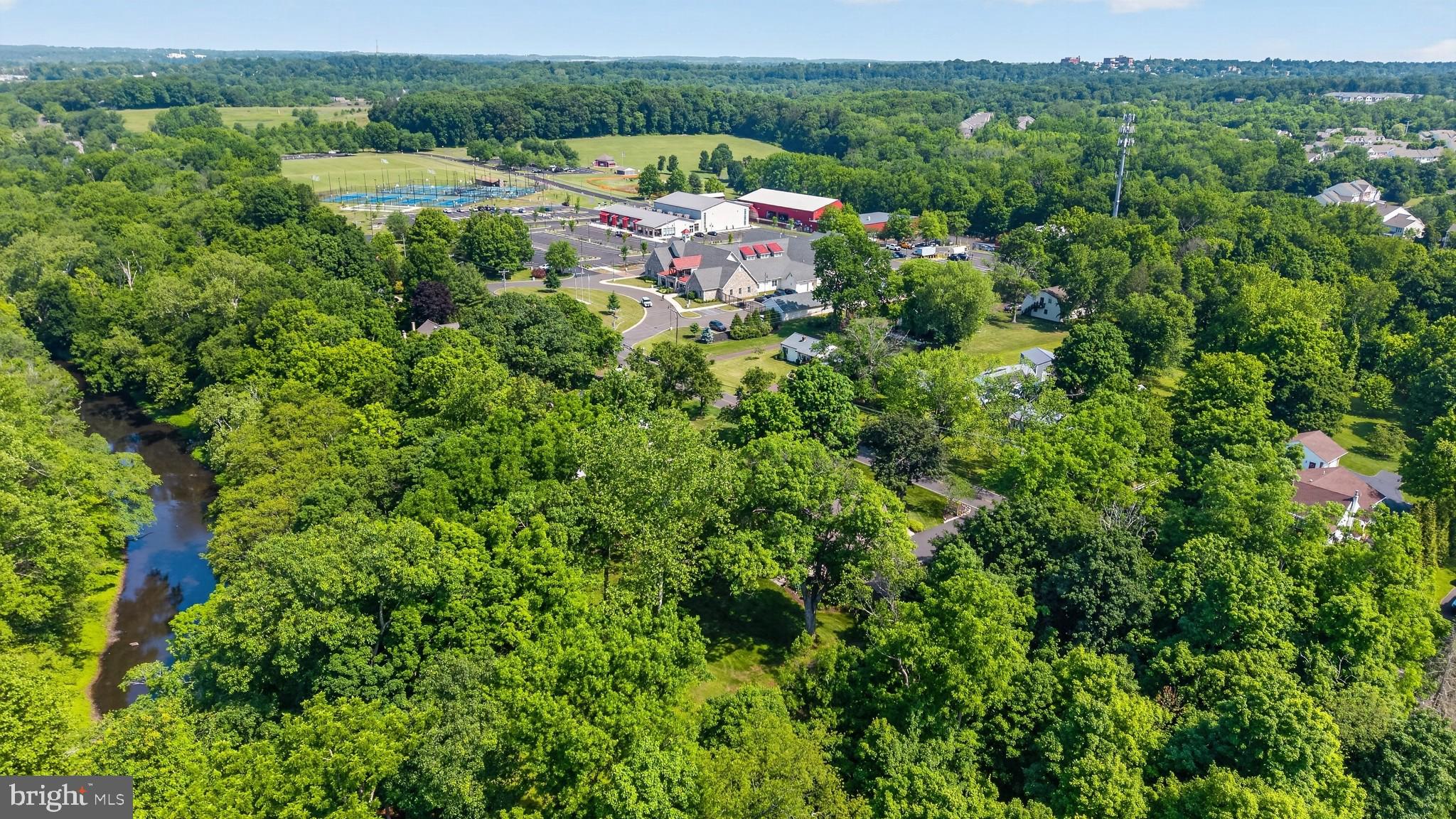 460 Wells Road Doylestown, PA 18901 - Photo 57 of 65 Lush greenery surrounds a vibrant community.