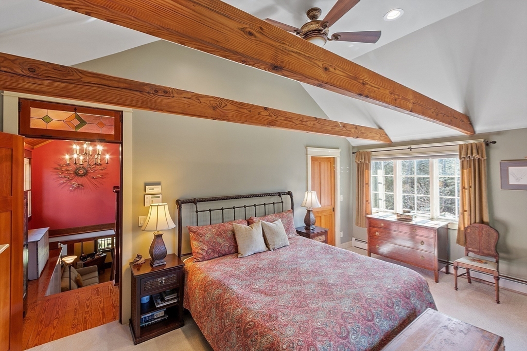 360 Teel Road Winchendon, MA 01475 - Photo 22 of 42 a bedroom with a bed and wooden floor