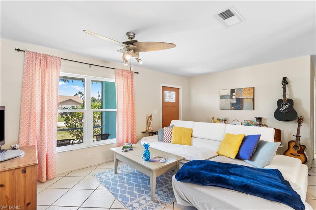 9208 Hamlin Road East Fort Myers, FL 33967 - Photo 15 of 31 Living room Entrance featuring ceiling fan and light tile floors