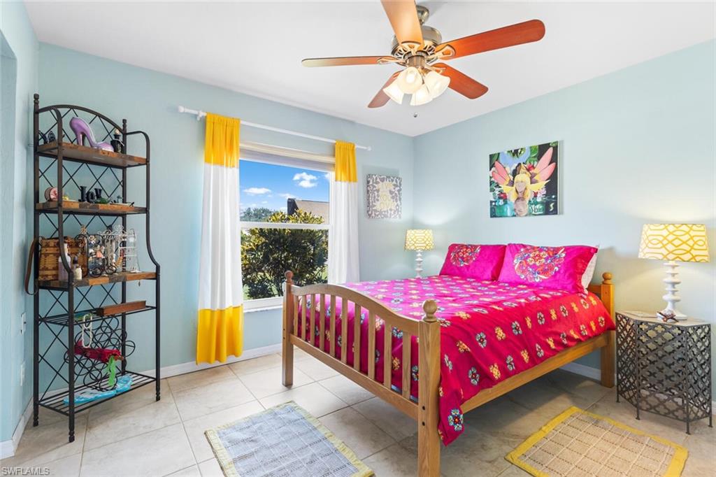 9208 Hamlin Road East Fort Myers, FL 33967 - Photo 24 of 31 Bedroom featuring ceiling fan and light tile floors