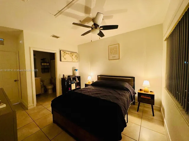 a bed room with a bed and a window