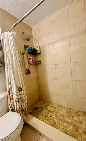 a bathroom with a sink and a shower