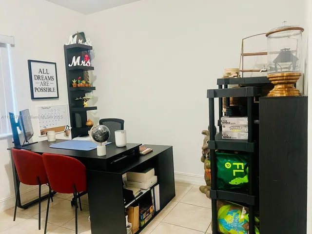 a view of a workspace with furniture