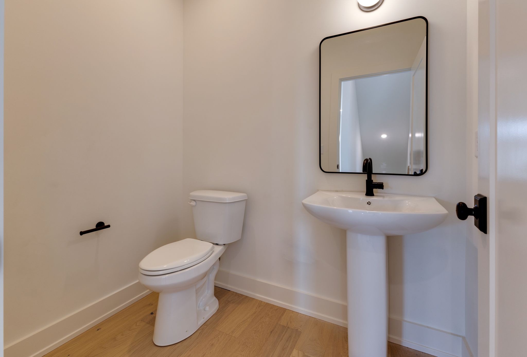 531 Midnight Way Nashville, TN 37209 - Photo 13 of 44 a bathroom with a toilet sink and mirror