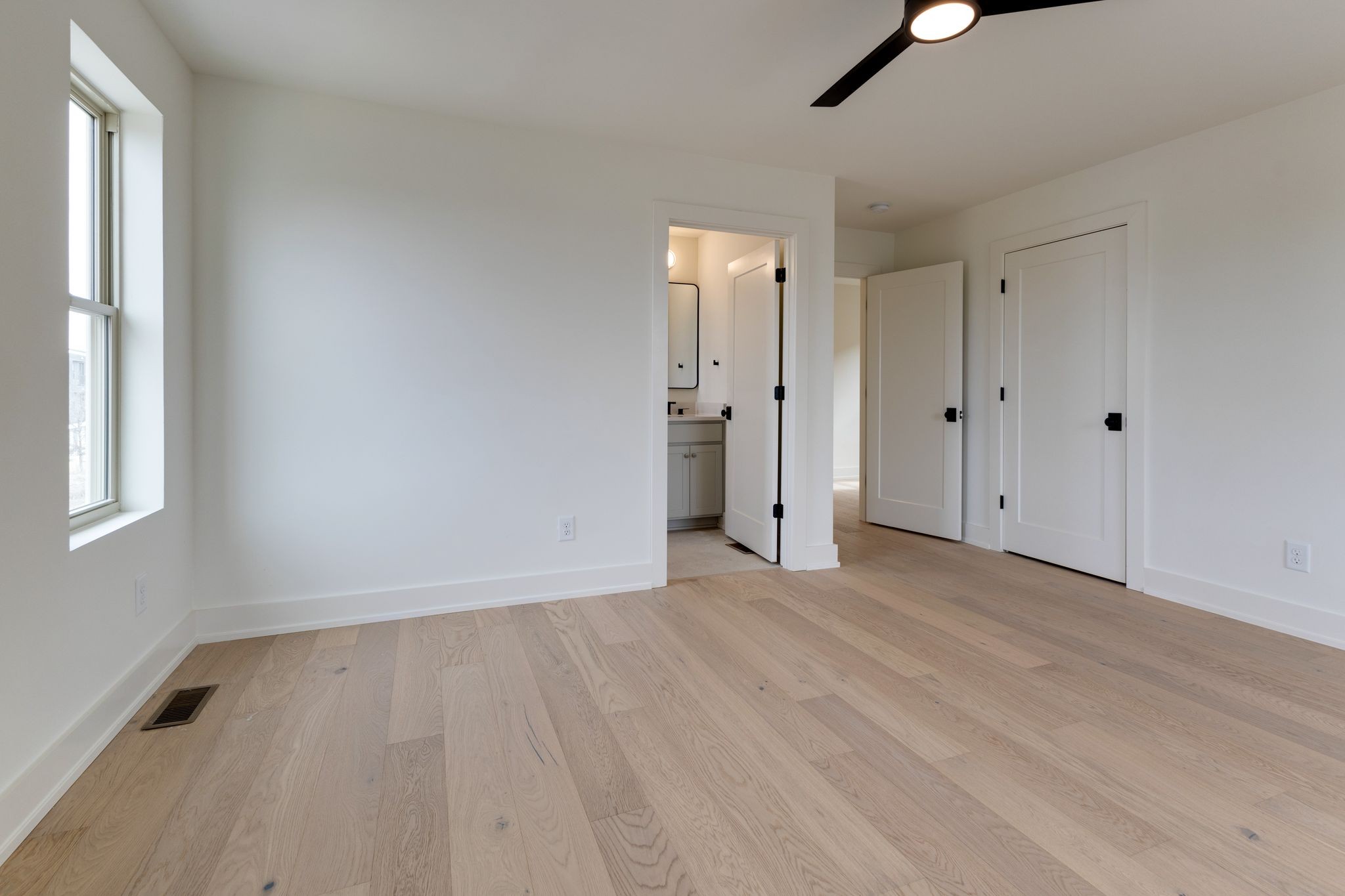 531 Midnight Way Nashville, TN 37209 - Photo 17 of 44 a view of an empty room with wooden floor and a window