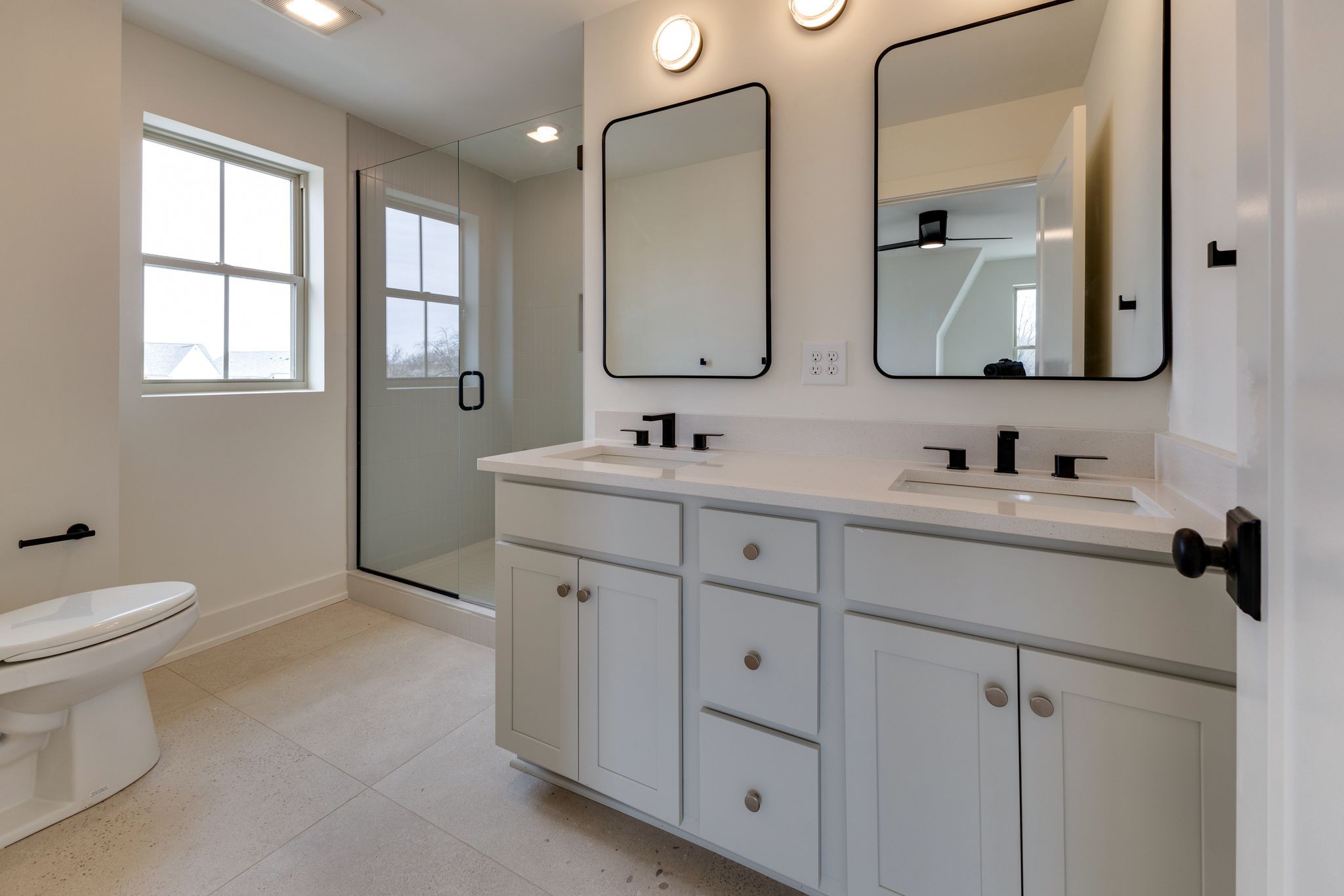 531 Midnight Way Nashville, TN 37209 - Photo 18 of 44 a bathroom with double vanity sink a mirror and a toilet